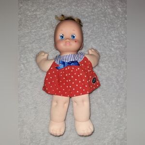 Magic Nursery Baby Doll Soft Body Blue Eyes Red Heart Dress Plush Vintage Toy